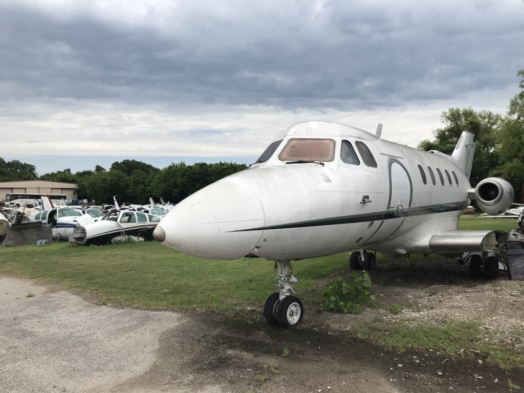 picture of abandoned hawker jet at aircraft salvage yard